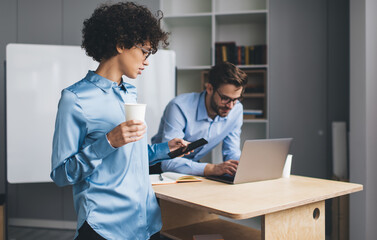 Millenial business man and woman working in office