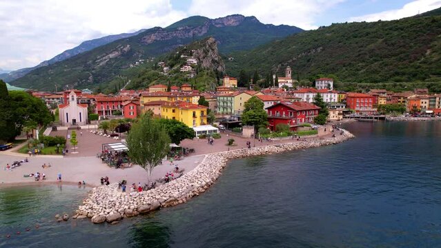 Scenic Garda lake,  popular beautiful town and resort Torbole. aerial drone overflight 4k video. Trentino, Lago di Garda, Italy
