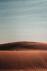 Nature's masterpiece: Intricate patterns sculpted by wind upon the desert sands, a captivating...