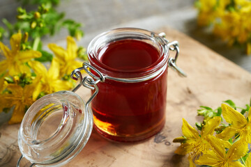 Red St. John's wort oil with fresh flowers