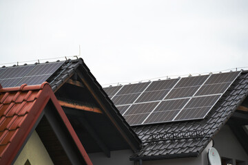Fototapeta premium Installing a Solar Cell on a Roof.
