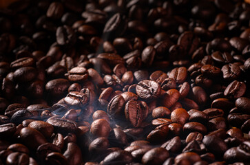 Roast coffee beans with faint smoke or steam from baking. Roast coffee beans before blending or...