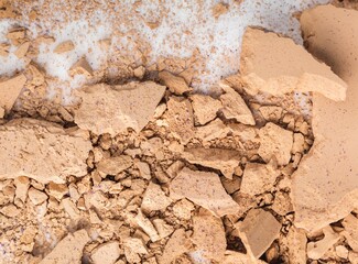 Top view of beige broken face powder