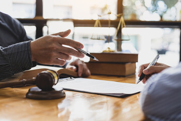Legal consulting services, legal negotiations, Lawyers are signing legal contract agreement documents.