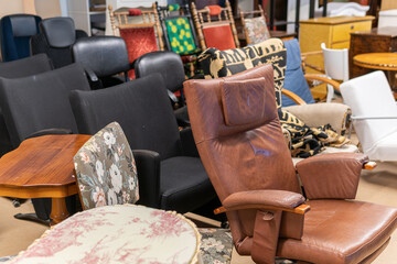 A big second hand store, a lot of used furniture sofas, chairs, tables, cupboards. Wooden furniture...