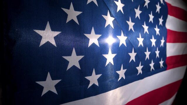 American Flag Waves In Slow Motion Backlit