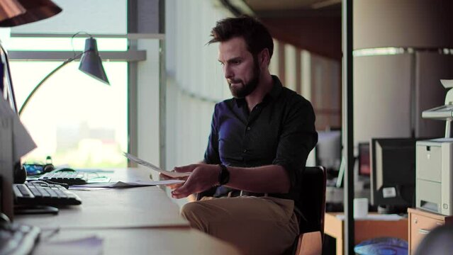 The focused manager is reading the corporate financial audit report	