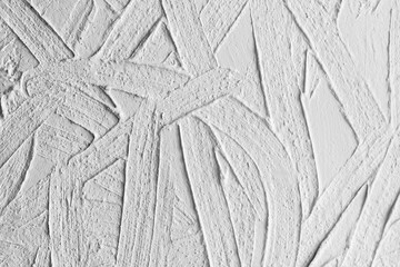 White concrete wall with decorative relief stucco layer