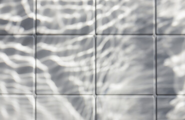 Under water light shadows on white ceramic tile texture background