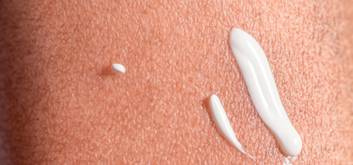 Close up of Sunscreen Protection or Sun Cream on human skin. Skin and Body Care. SPF Lotion or Moisturizing Sunblock to protect skin from the sun UV Sun screen cosmetic cream texture skincare product