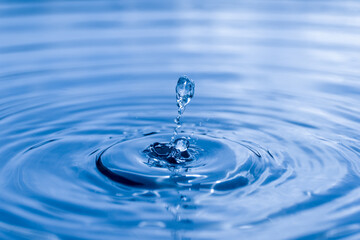 Naklejka na ściany i meble blue drop water , Liquid blue water drop ripple background