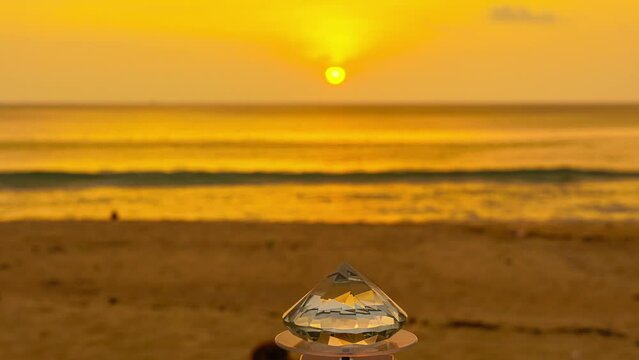 .Time lapse The diamond sparkled brilliantly, .a perfect complement to the golden sky of the setting sun..An amazing sunset with a gradient yellow sky.