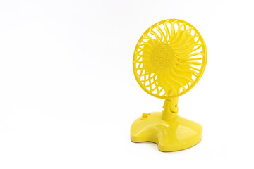 Yellow electric fan on whithe background