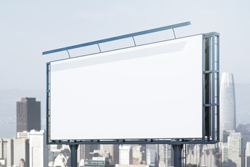 Blank white horizontal billboard on skyline background at daytime, perspective view. Mock up, advertising concept