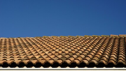 shingle roof against the sky