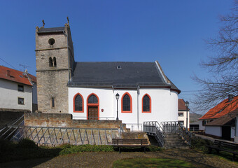 Naklejka premium Medieval village church with leaning romanesque bell tower and roman excavations in Boos, Rheinland-Pfalz region in Germany