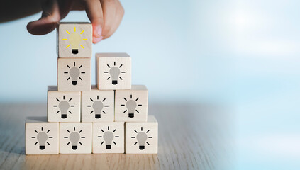 Child hands imagining wooden blocks. Success. Creative concept and innovation in technology....