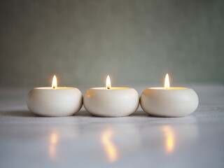 Fototapeta na wymiar Three lit candles, minimalism.