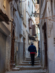 Algiers (Alger), Algeria : Street scene in the Casbah of Algiers (Alger), Algeria. Man getting up...