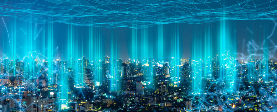 Modern city with wireless network connection and city scape concept.Wireless network and Connection technology concept with city background at night. - Powered by Adobe