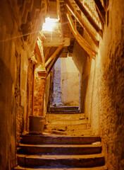 Street night scene in the Casbah of Algiers (Alger), Algeria. Narrow street. Wooden structure...
