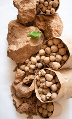 Edible brown and caramel clay stones on a white background