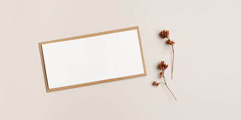 Top view blank white paper card and craft paper envelopment, autumn letter  with copy space for...