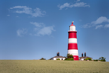 Fototapeta na wymiar View of Happisburgh lighthouse on a spring afternoon, North Norfolk, England