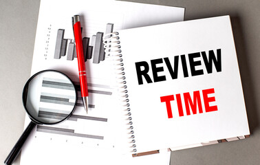 REVIEW TIME text written on notebook with chart