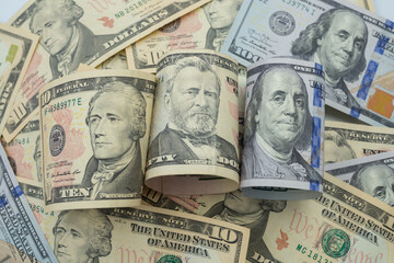 USD currency , Many dollar bank notes Placed on the table.The  Dollar is the currency of USA that is used to change, buy, sell, accumulate, and invest in united kingdom's state people.