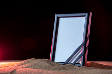 front view of empty picture frame on a dark background death funeral israel