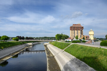Fototapeta na wymiar Vukovar, Croatia. Vuka river, old water tower and building in the city center.