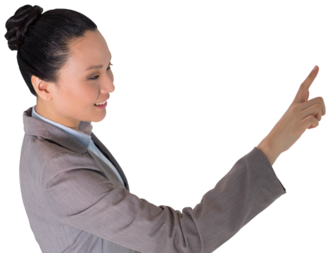 Digital png photo of smiling asian businesswoman pointing with finger on transparent background