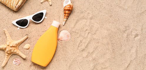 Beach accessories and sea shells on sand. Banner for design