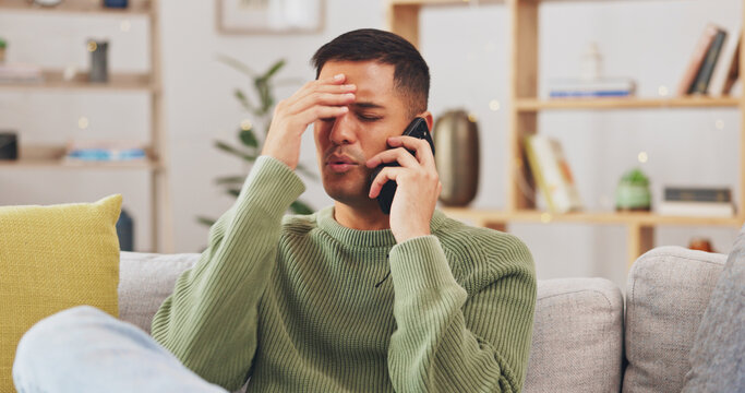 Angry, man and phone call communication in home with anger problem, stress and conflict on sofa lounge. Frustrated male person, smartphone and talking for mobile conversation, argument and complaint