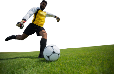 Digital png photo of hispanic footballer kicking ball on transparent background