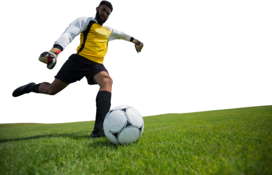 Digital png photo of hispanic footballer kicking ball on transparent background - Powered by Adobe