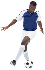 Digital png photo of african american footballer kicking ball on transparent background