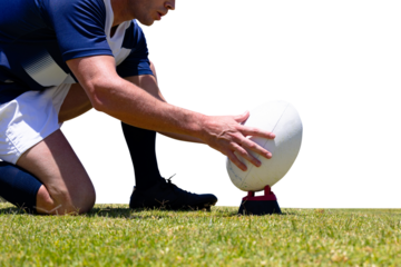Digital png photo of caucasian rugby player putting down ball on transparent background