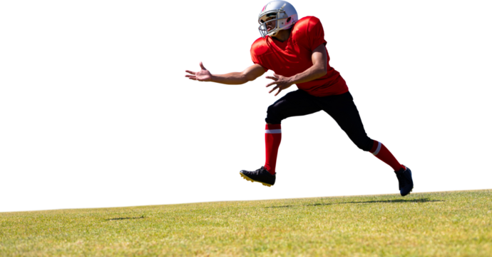 Digital png photo of african american rugby player catching ball on transparent background - Powered by Adobe