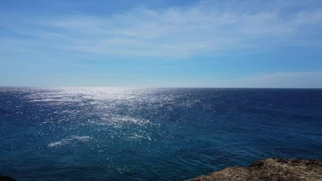Sunny Caribbean Sea coast with tropical blue water ocean landscape. Flying drone arial shot rocky and sandy beaches and beautiful waves. Perfect holiday travel exotic destination Curacao Aruba Bonaire