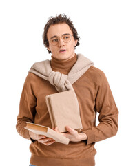 Young man with books on white background