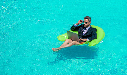 man trader work and relax. man trader work and relax in swimming pool. man trader work and relax...
