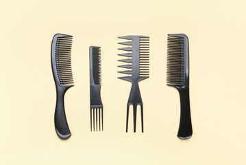 Hairdresser's brushes on beige background