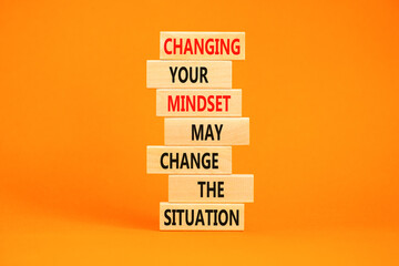Changing mindset symbol. Concept words Changing your mindset may change the situation on wooden blocks on a beautiful orange table orange background. Business motivational Changing mindset concept.