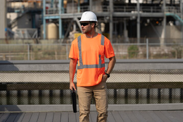 engineer man at construction site. engineer man at construction site wearing hardhat.