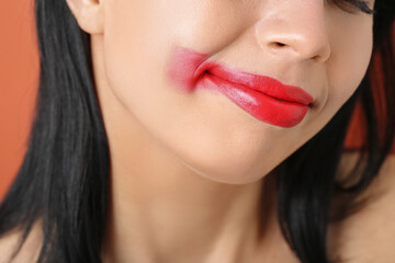 Woman with red lips on color background, closeup