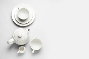 Stylish tea set on grey background