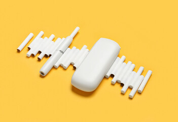 Composition with modern electronic cigar and sticks on orange background