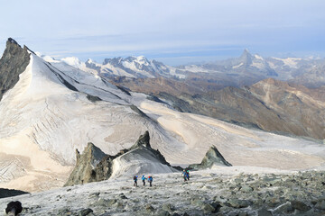 Panorama view with mountain Rimpfischhorn, mountain massif Monte Rosa, Matterhorn and acending rope...